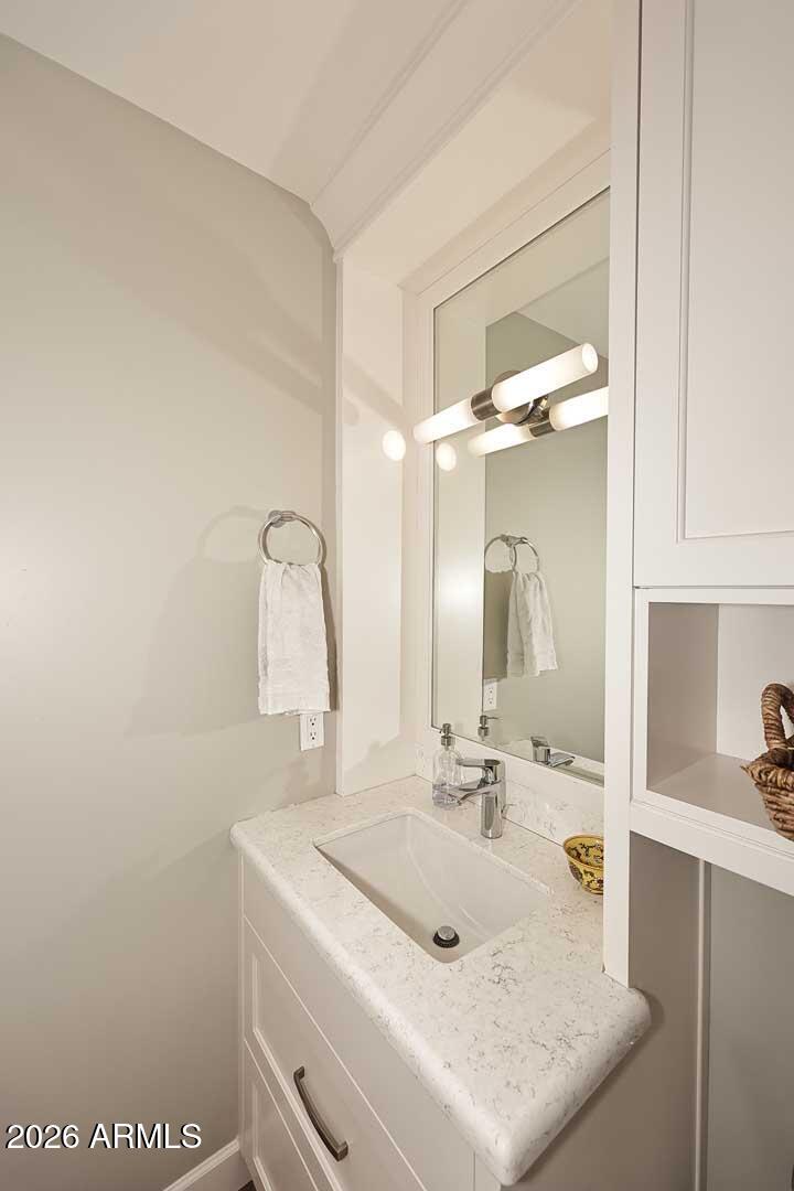 2525 East Pierson Street Phoenix, AZ 85016 - Photo 16 of 36 a bathroom with a sink and a mirror
