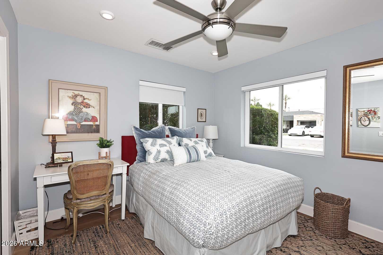 2525 East Pierson Street Phoenix, AZ 85016 - Photo 19 of 36 a bedroom with a bed and wooden floor