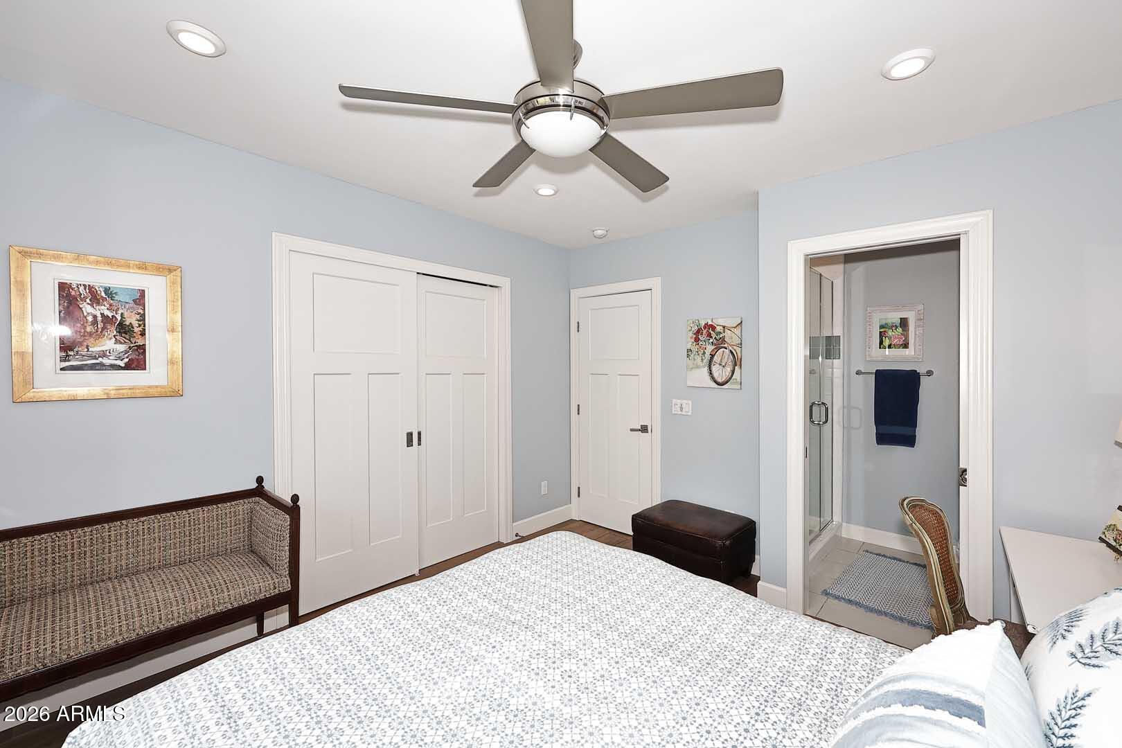 2525 East Pierson Street Phoenix, AZ 85016 - Photo 20 of 36 a bedroom with a bed and a chandelier