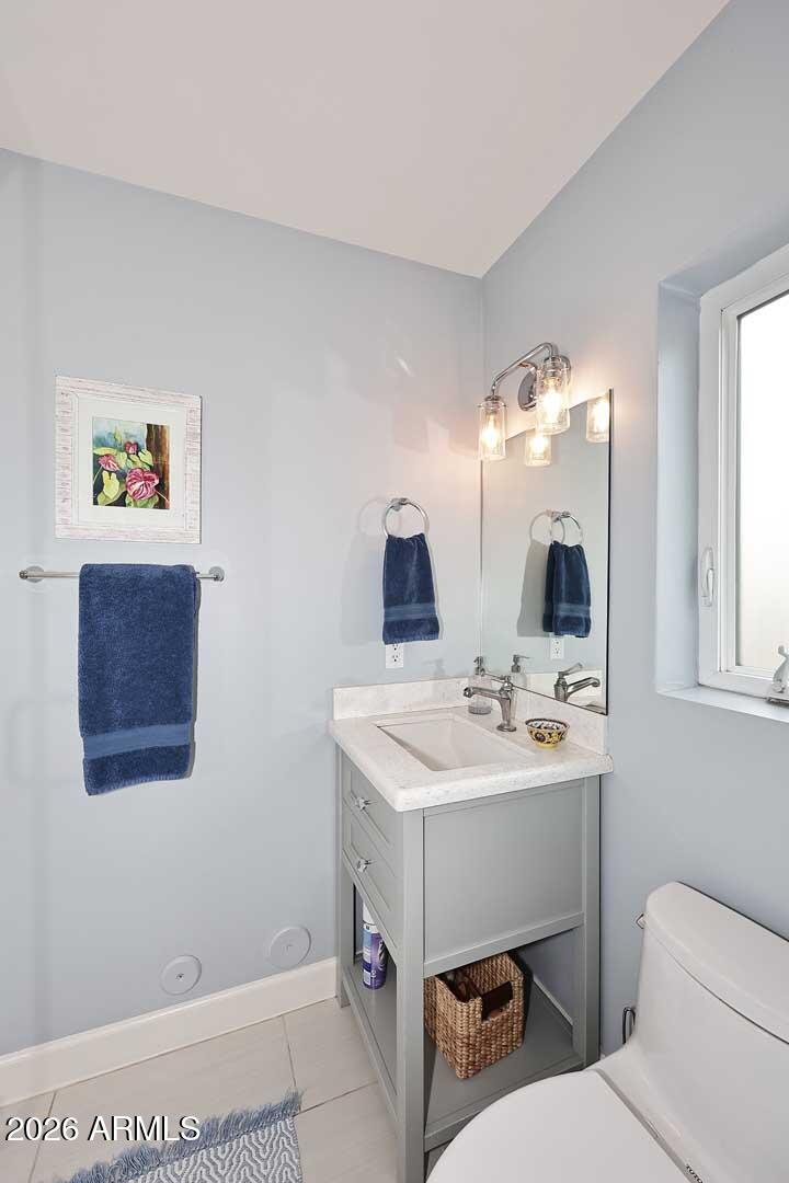 2525 East Pierson Street Phoenix, AZ 85016 - Photo 22 of 36 a bathroom with a toilet a sink and mirror