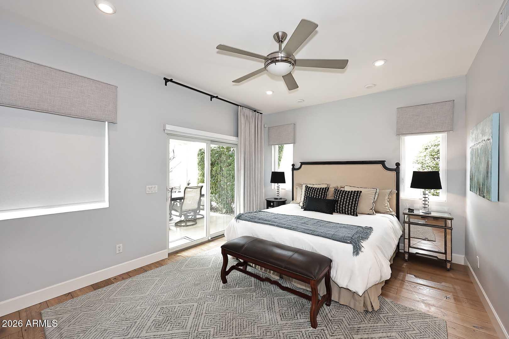2525 East Pierson Street Phoenix, AZ 85016 - Photo 25 of 36 a bedroom with a large bed and a chandelier