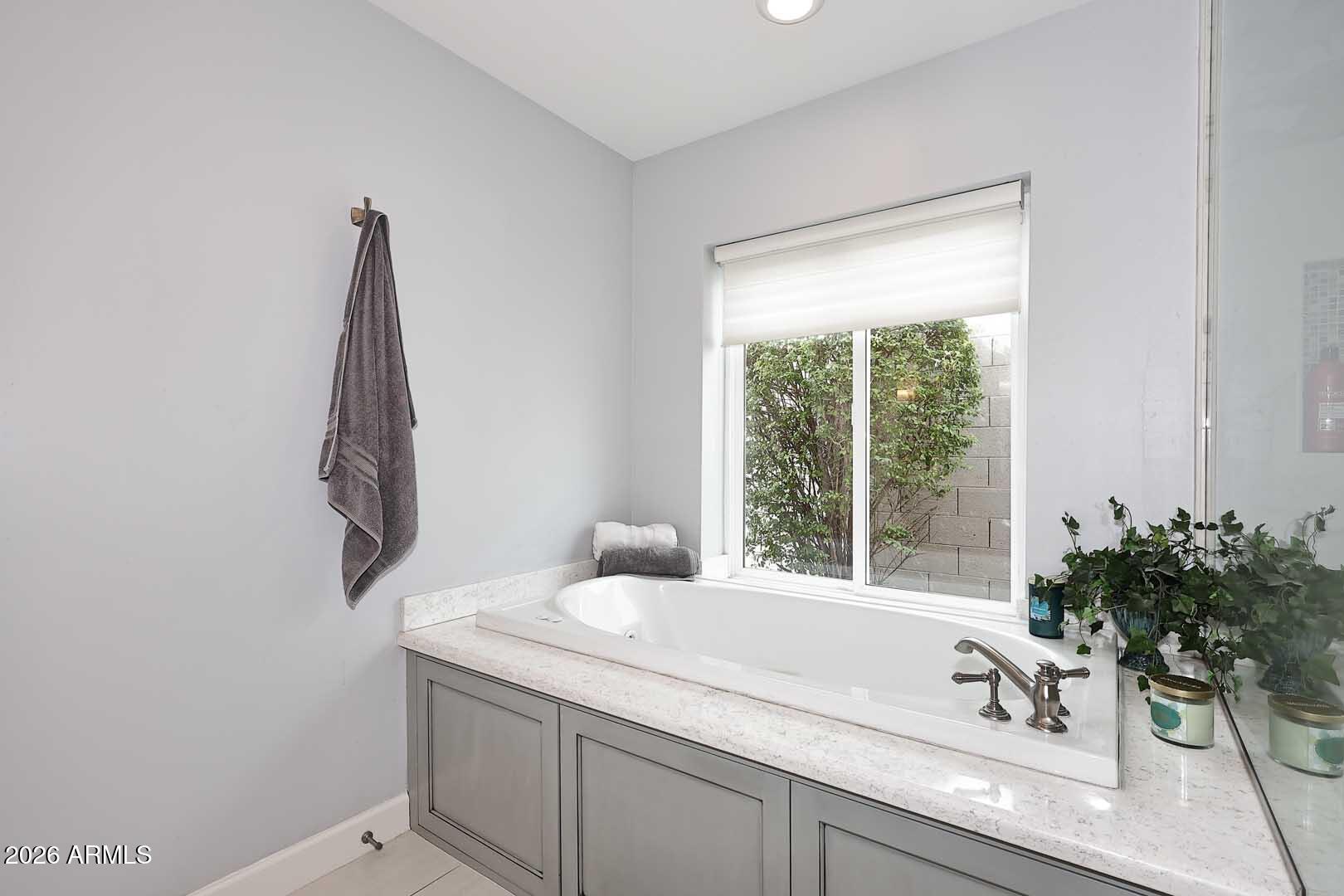 2525 East Pierson Street Phoenix, AZ 85016 - Photo 29 of 36 a bathroom with a granite countertop sink and a bathtub