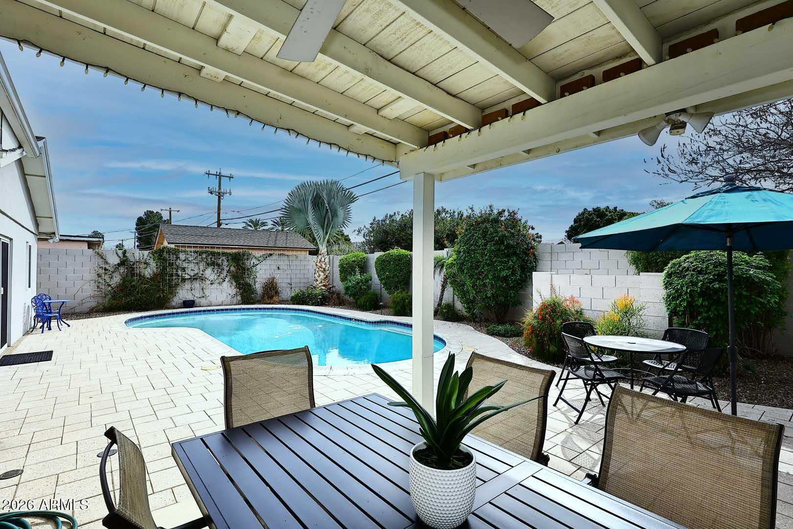 2525 East Pierson Street Phoenix, AZ 85016 - Photo 33 of 36 a view of a patio with table and chairs potted plants with wooden floor