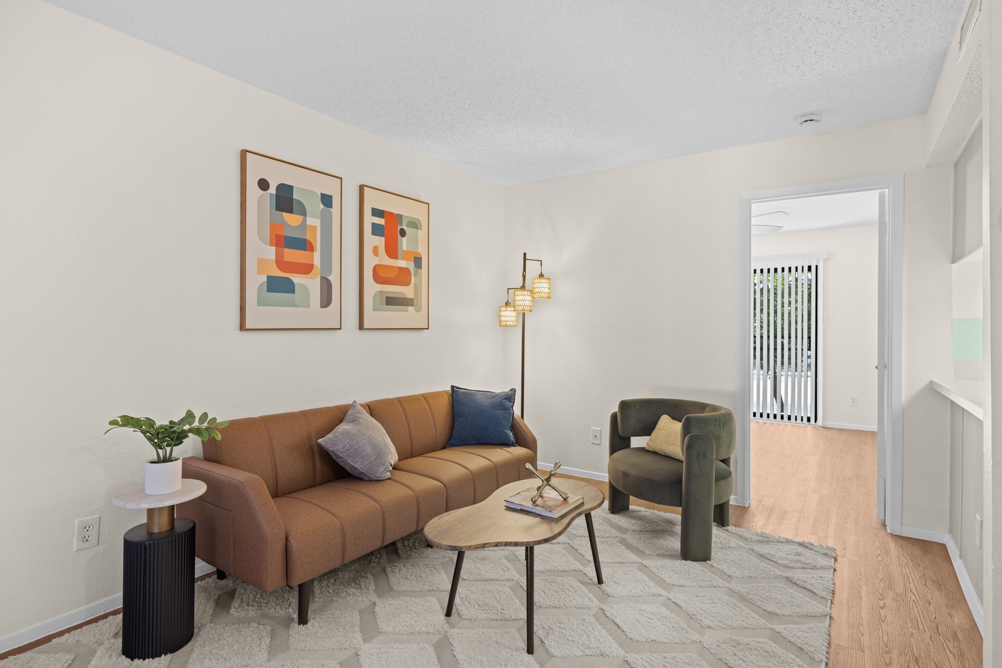 9079 Jollyville Road, Unit 301 Austin, TX 78759 - Photo 15 of 38 #103Well-lit living area showcases inviting flooring leading to an adjoining room.