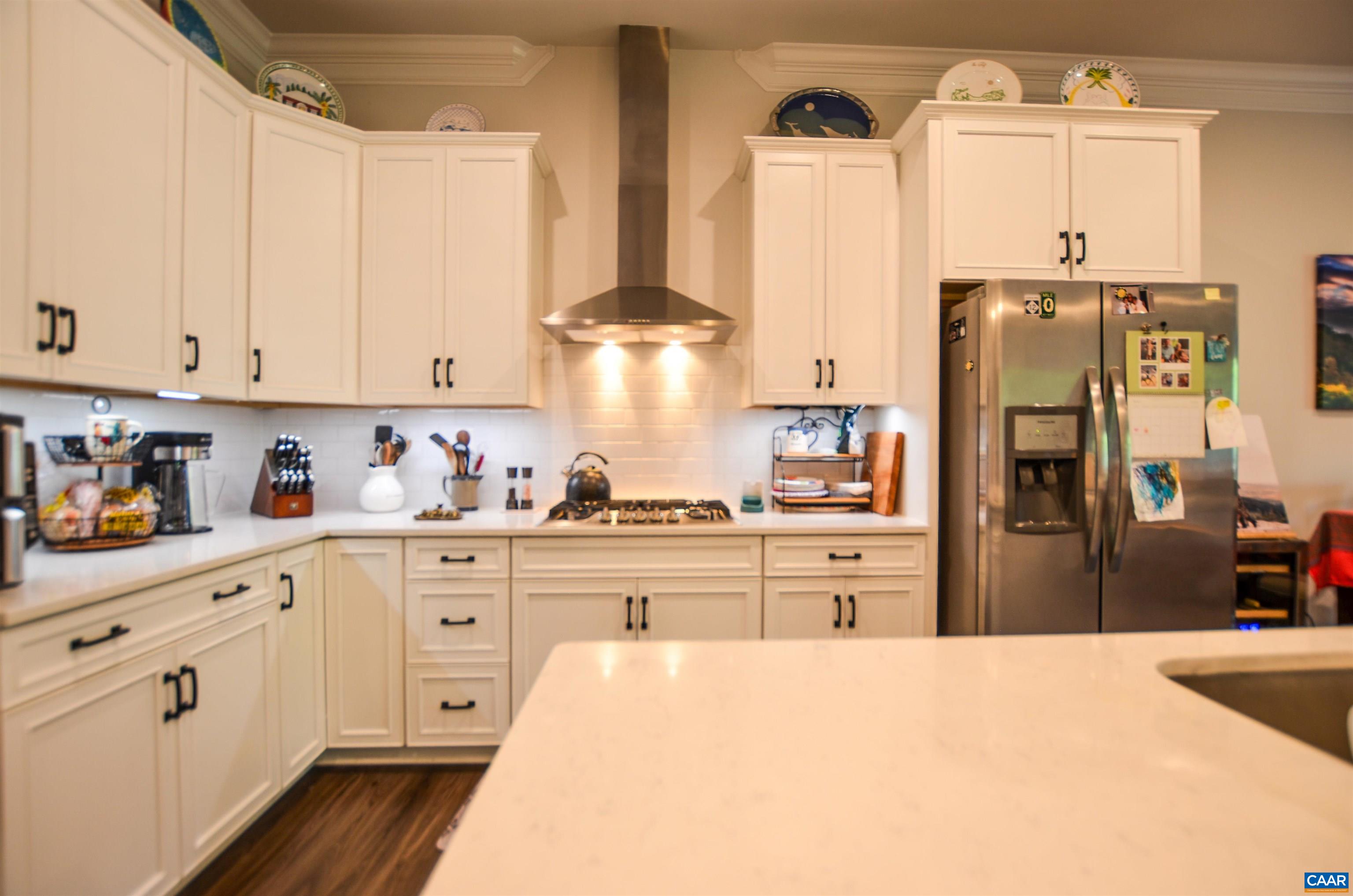 327 Claibourne Road Crozet, VA 22932 - Photo 12 of 36 a kitchen with stainless steel appliances a refrigerator sink and cabinets
