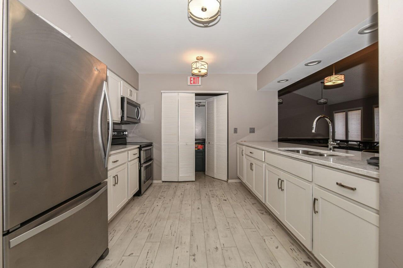 3759 North 88th Street, Unit 105 Milwaukee, WI 53222 - Photo 32 of 34 Clubhouse kitchen