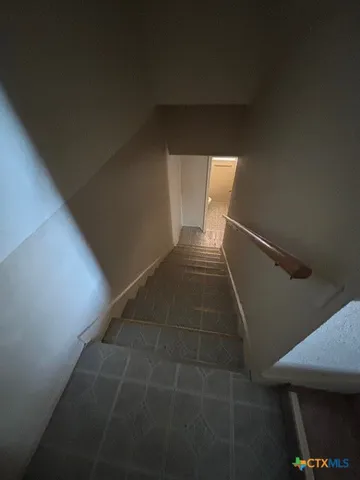 a room with furniture and air hockey table