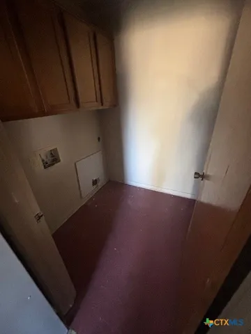 a kitchen with a sink and a stove top oven