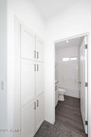 a bathroom with a toilet sink and a shower