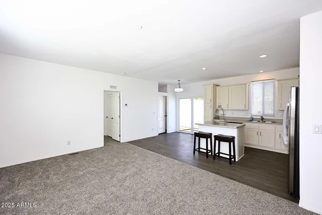 a view of kitchen with stainless steel appliances cabinets