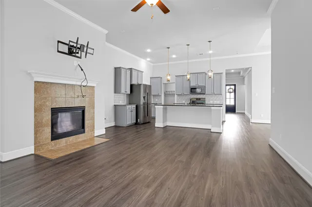 a view of a kitchen and an empty room