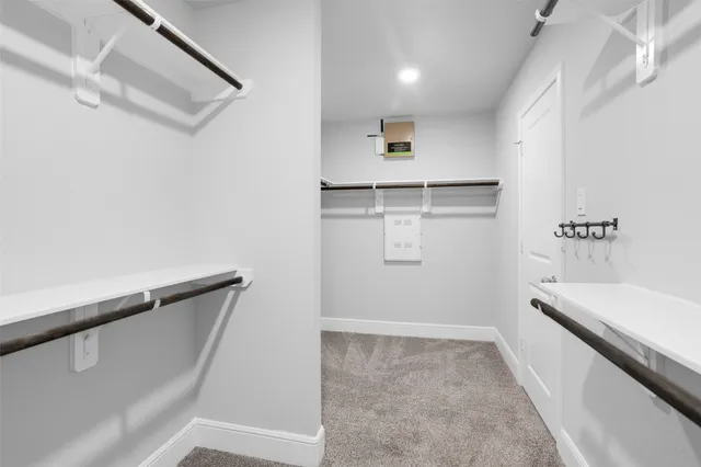 a view of storage and utility room with racks on the wall