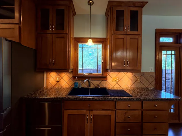 a view of a backyard of the house