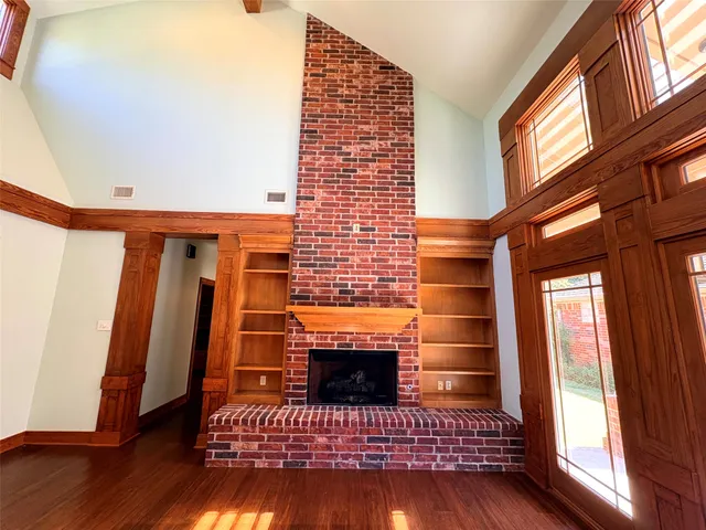 a view of a livingroom with furniture wooden floor and window