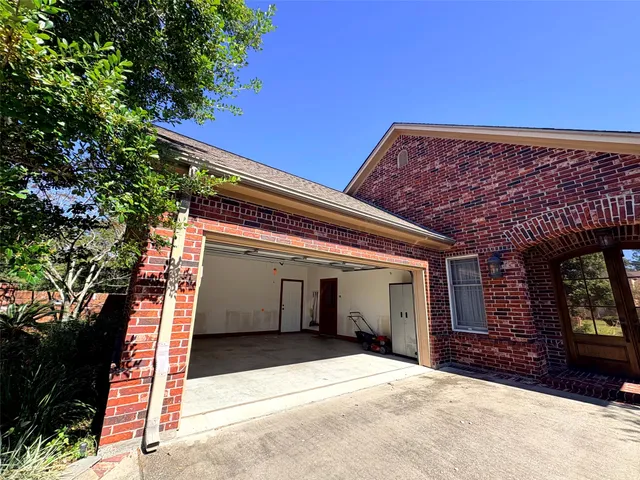 a kitchen with white cabinets and a stove top oven