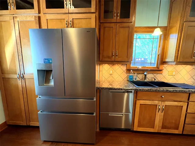 a view of livingroom with fireplace wooden floor and windows