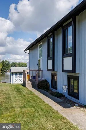 a kitchen with stainless steel appliances a refrigerator sink and microwave