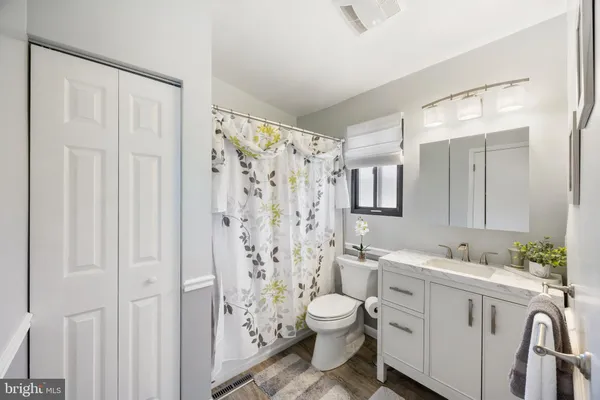 a view of a house with a yard balcony and sitting area