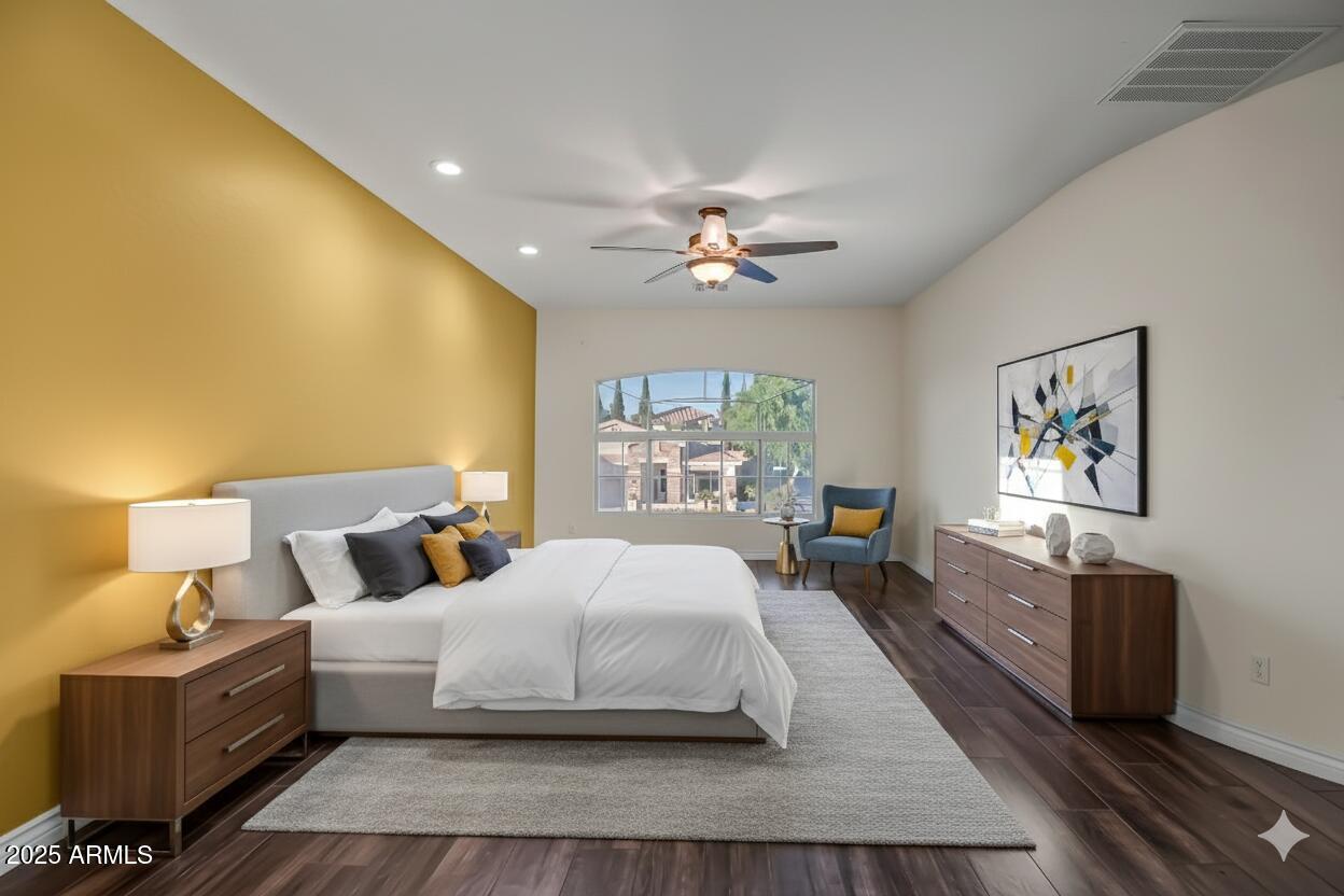 9569 West Redbird Road Peoria, AZ 85383 - Photo 15 of 36 a bedroom with a large bed a chandelier and dresser