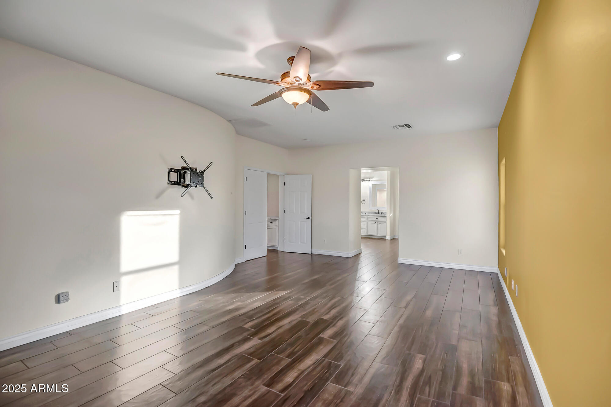 9569 West Redbird Road Peoria, AZ 85383 - Photo 18 of 36 a view of empty room with wooden floor