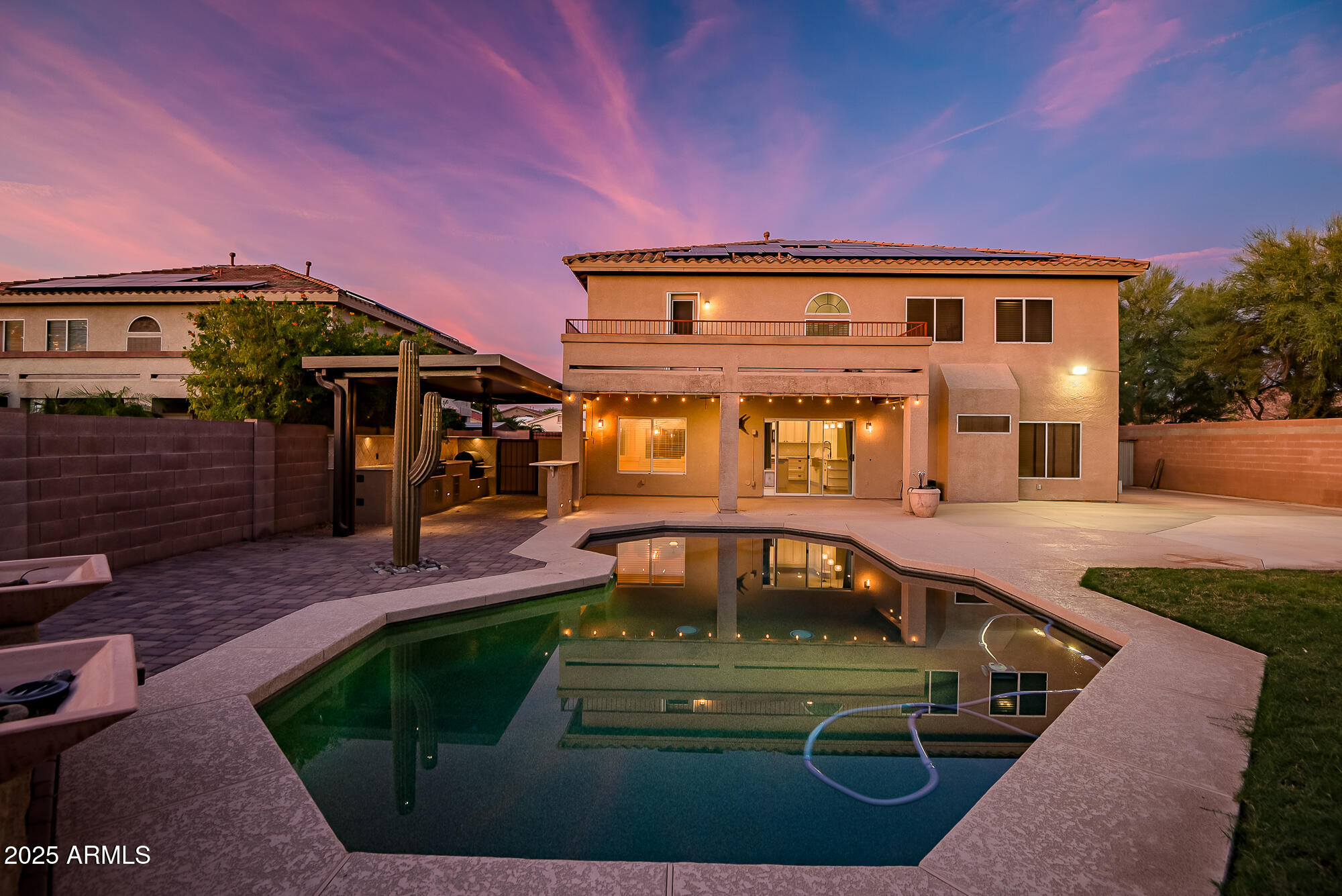 9569 West Redbird Road Peoria, AZ 85383 - Photo 2 of 36 a view of a house with a yard