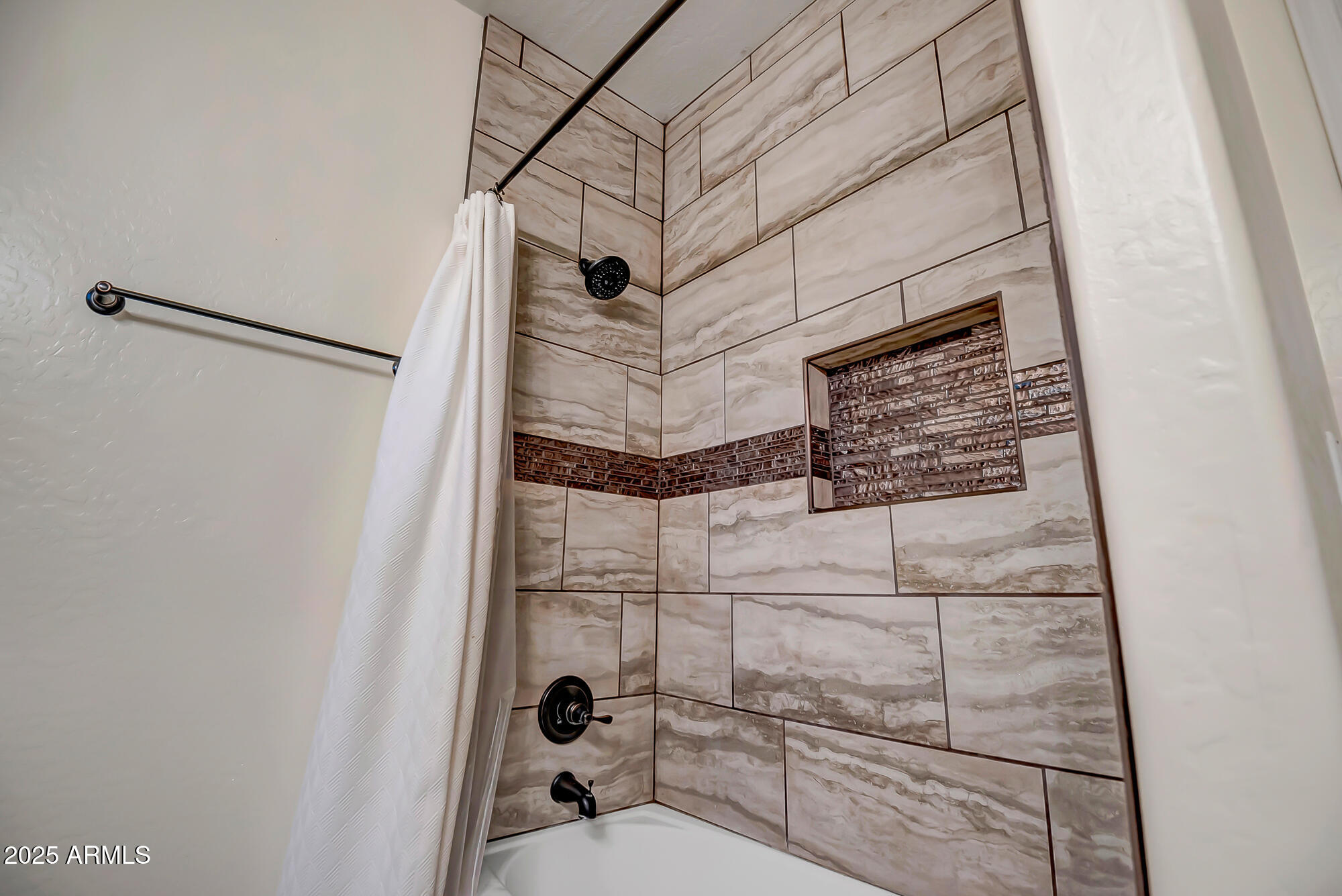 9569 West Redbird Road Peoria, AZ 85383 - Photo 24 of 36 a bathroom with a shower and a mirror