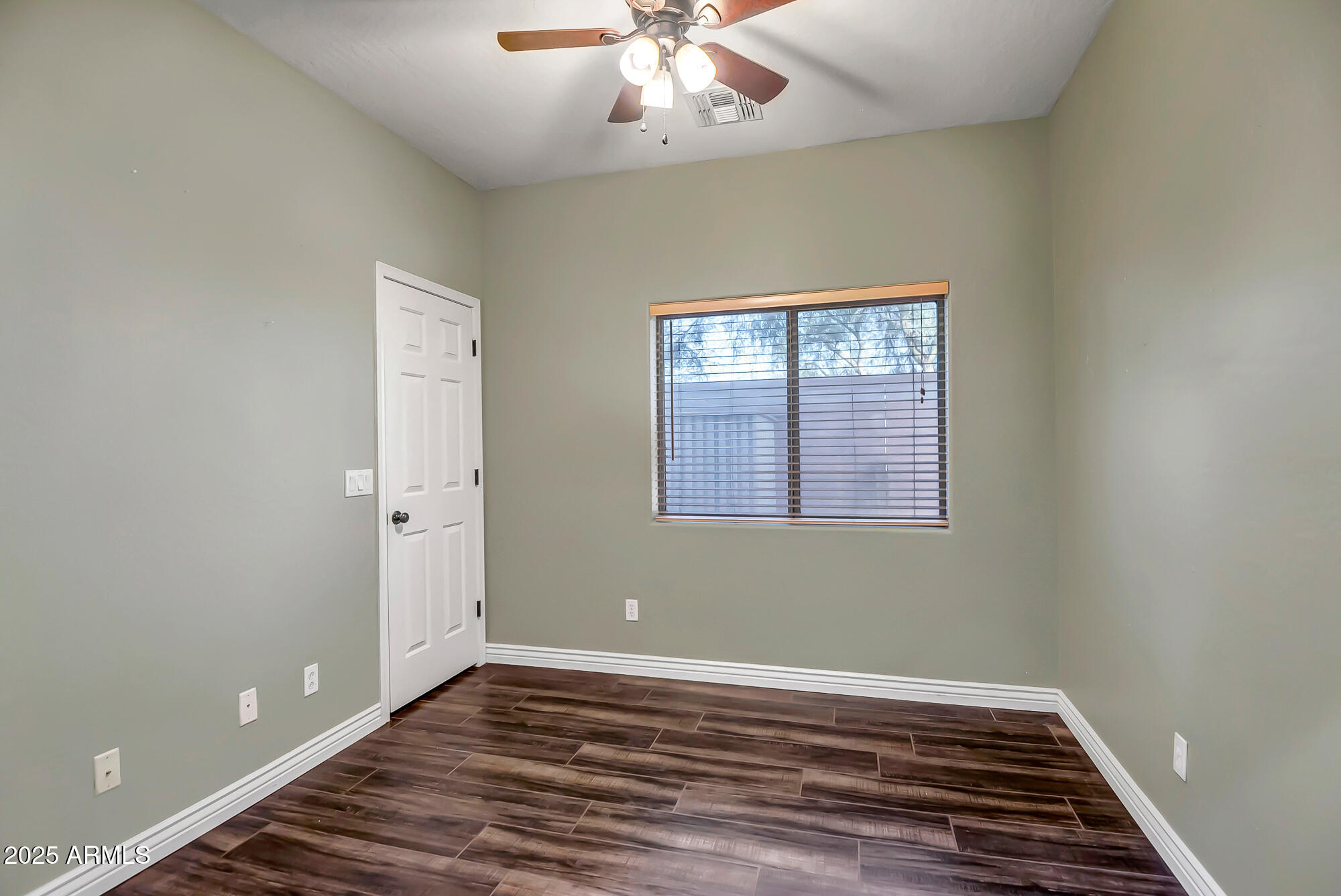 9569 West Redbird Road Peoria, AZ 85383 - Photo 25 of 36 wooden floor in an empty room with a window