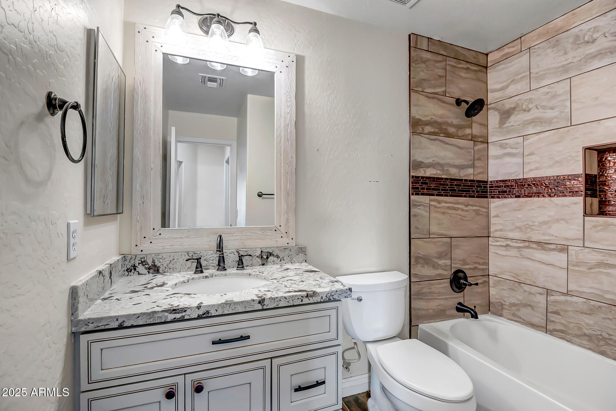 9569 West Redbird Road Peoria, AZ 85383 - Photo 26 of 36 a bathroom with a granite countertop sink toilet and shower