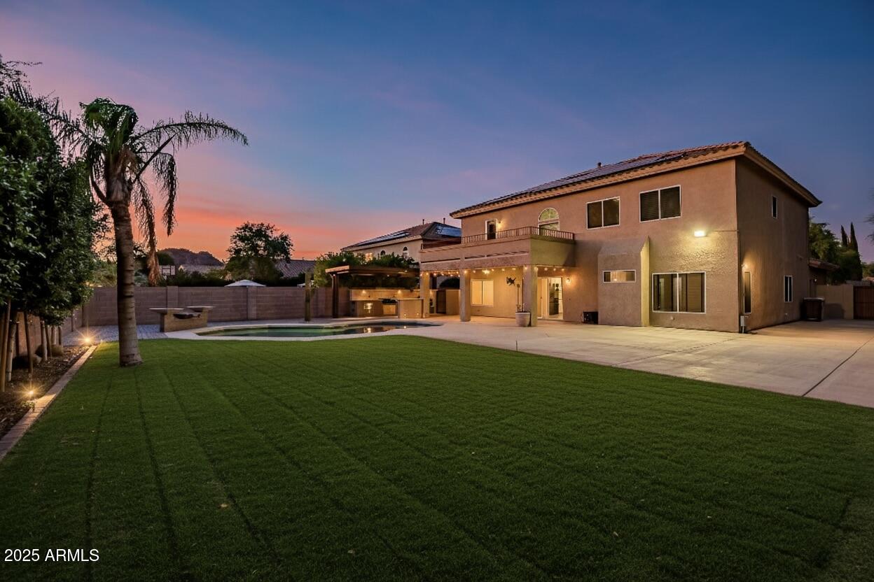 9569 West Redbird Road Peoria, AZ 85383 - Photo 29 of 36 a front view of a house with a yard