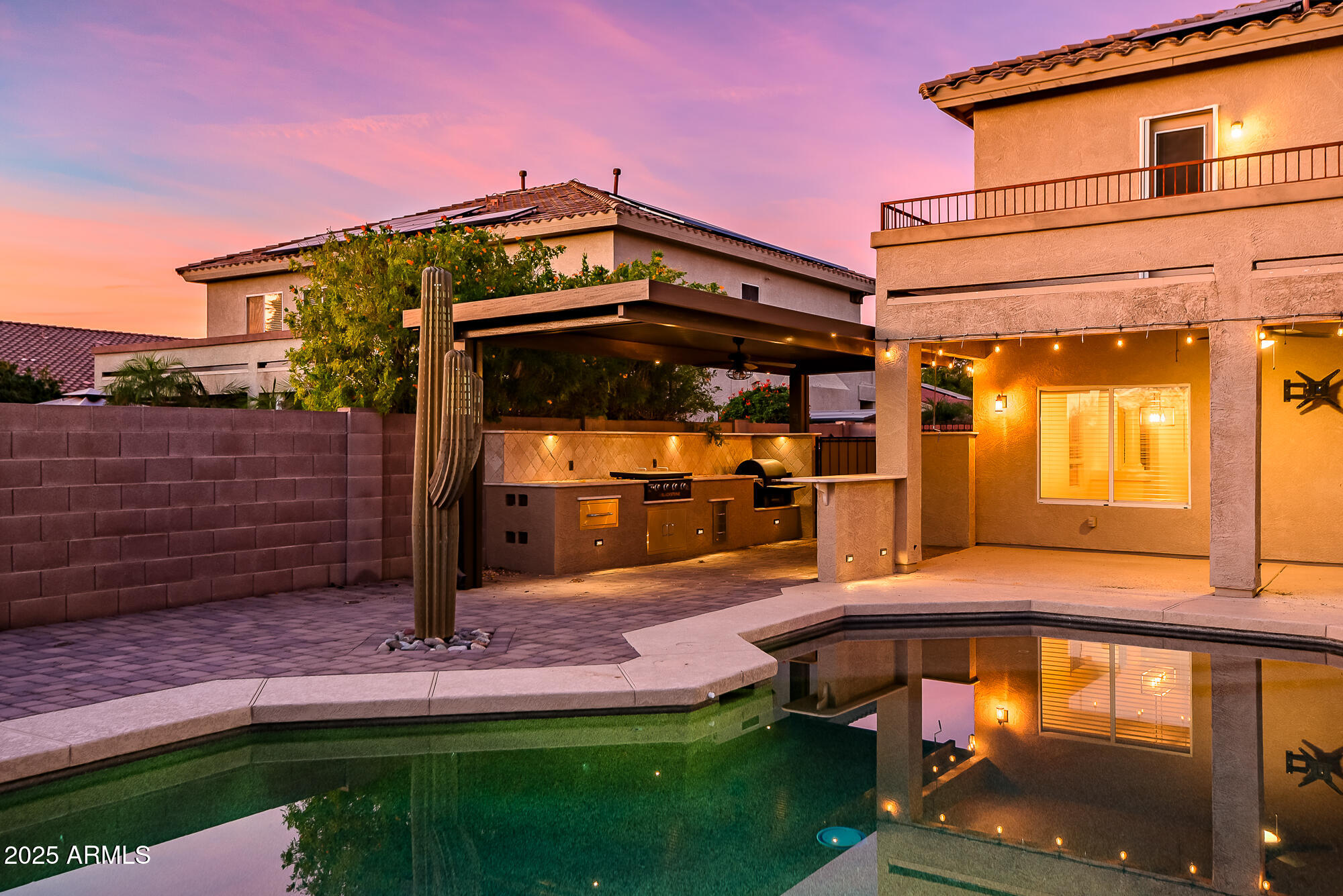 9569 West Redbird Road Peoria, AZ 85383 - Photo 3 of 36 a front view of a house with garden
