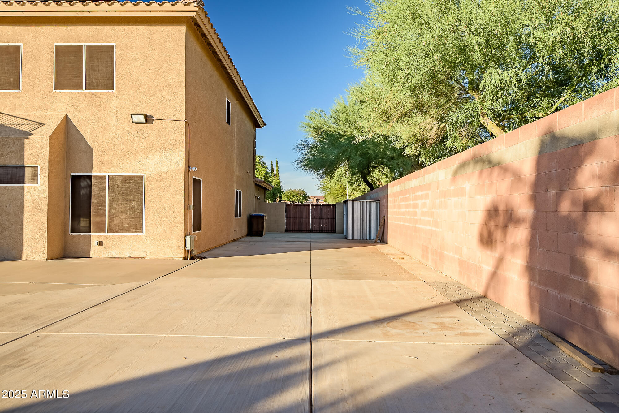 9569 West Redbird Road Peoria, AZ 85383 - Photo 36 of 36 a backyard of a house with potted plants