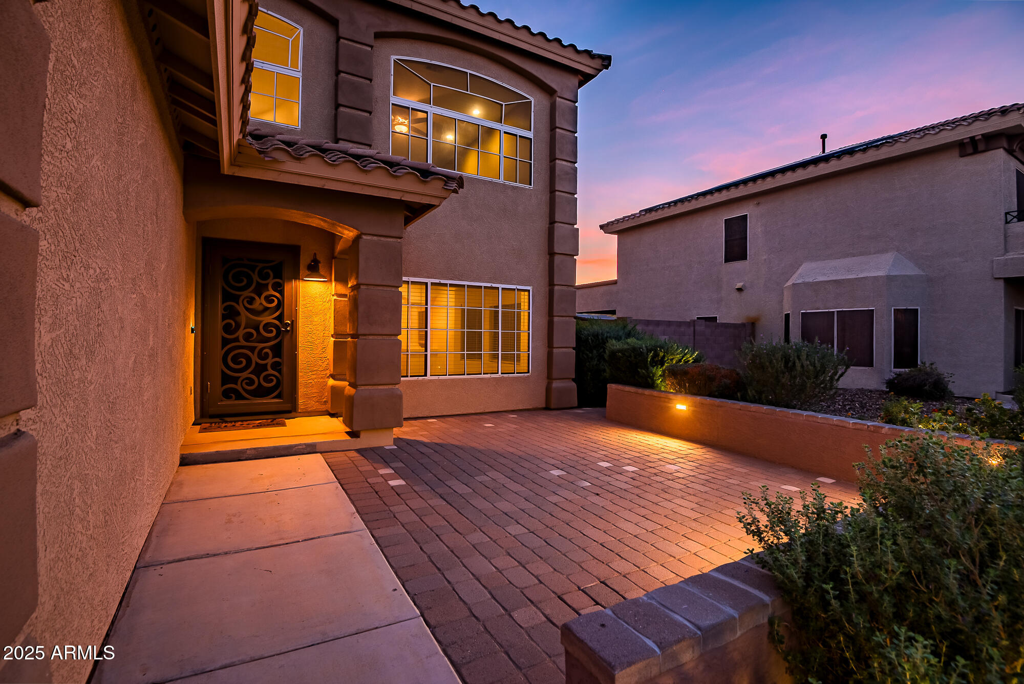 9569 West Redbird Road Peoria, AZ 85383 - Photo 7 of 36 a front view of a house with a yard