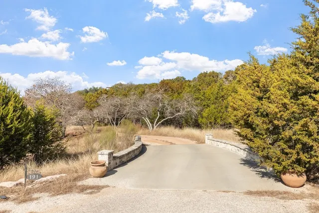 a view of a wooden door and bench