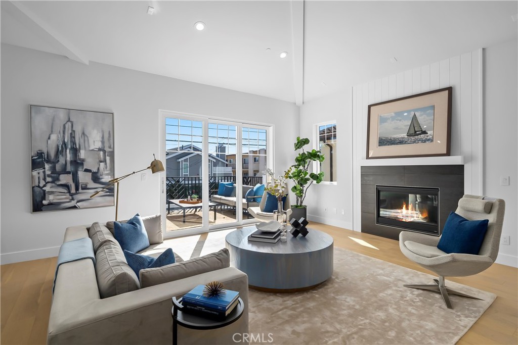 2317 Vanderbilt Lane, Unit A Redondo Beach, CA 90278 - Photo 14 of 39 a living room with furniture and a fireplace