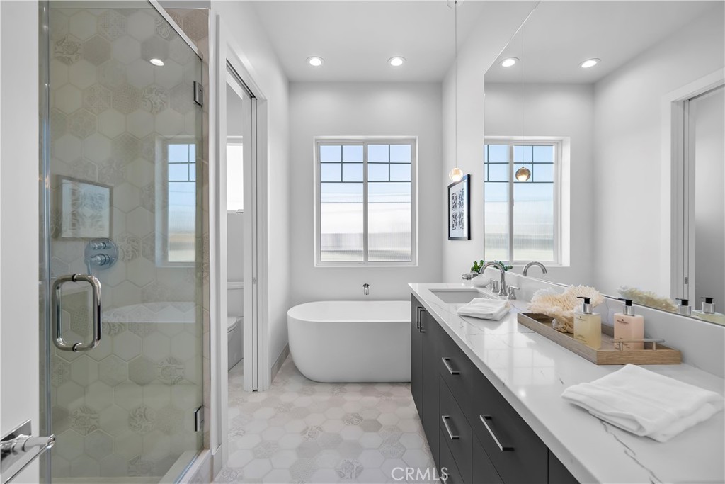 2317 Vanderbilt Lane, Unit A Redondo Beach, CA 90278 - Photo 23 of 39 a spacious bathroom with a double vanity sink mirror and shower