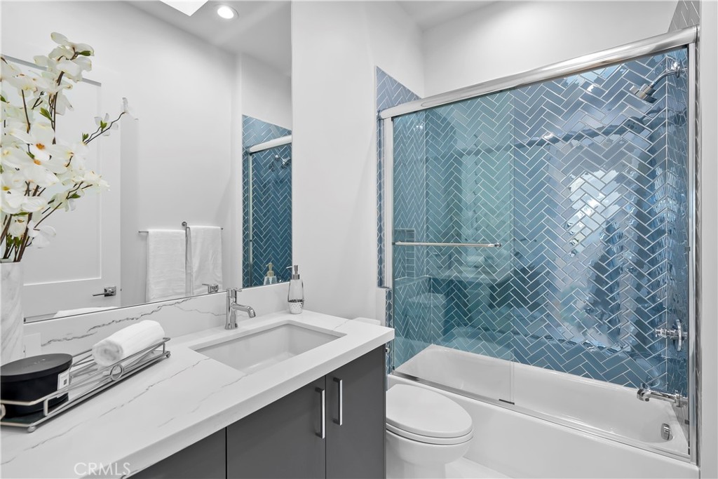 2317 Vanderbilt Lane, Unit A Redondo Beach, CA 90278 - Photo 24 of 39 a bathroom with a granite countertop sink a toilet and a bathtub