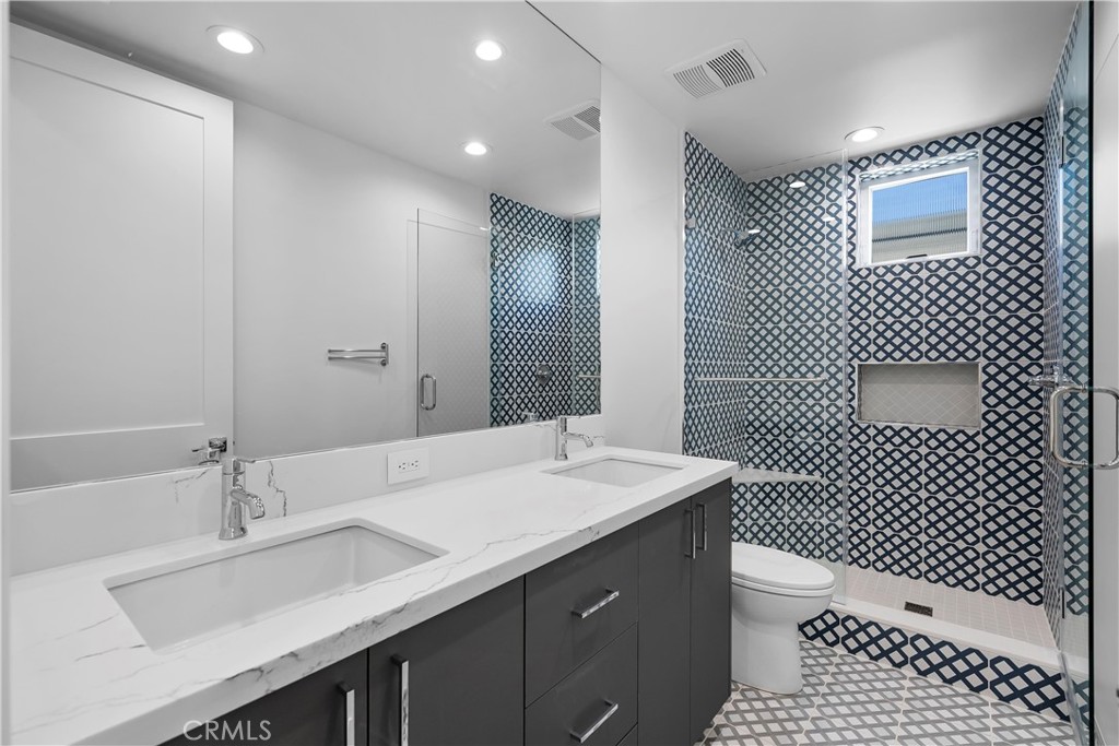 2317 Vanderbilt Lane, Unit A Redondo Beach, CA 90278 - Photo 25 of 39 a bathroom with a sink a toilet and shower