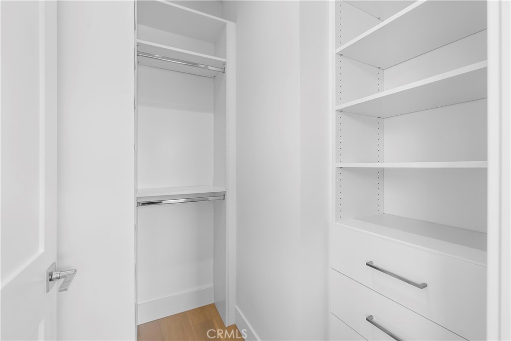 2317 Vanderbilt Lane, Unit A Redondo Beach, CA 90278 - Photo 36 of 39 a view of walk in closet with empty racks