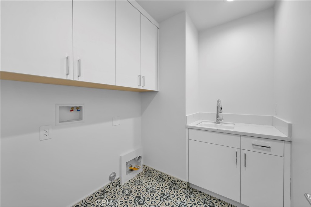 2317 Vanderbilt Lane, Unit A Redondo Beach, CA 90278 - Photo 37 of 39 a bathroom with a sink and cabinets