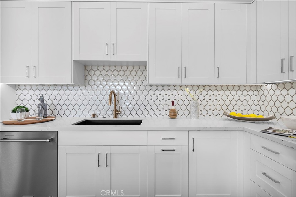 2317 Vanderbilt Lane, Unit A Redondo Beach, CA 90278 - Photo 8 of 39 a kitchen with a sink a stove and cabinets