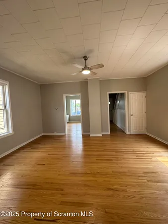 a view of an empty room and window