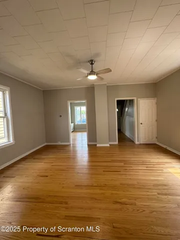 a view of an empty room and window