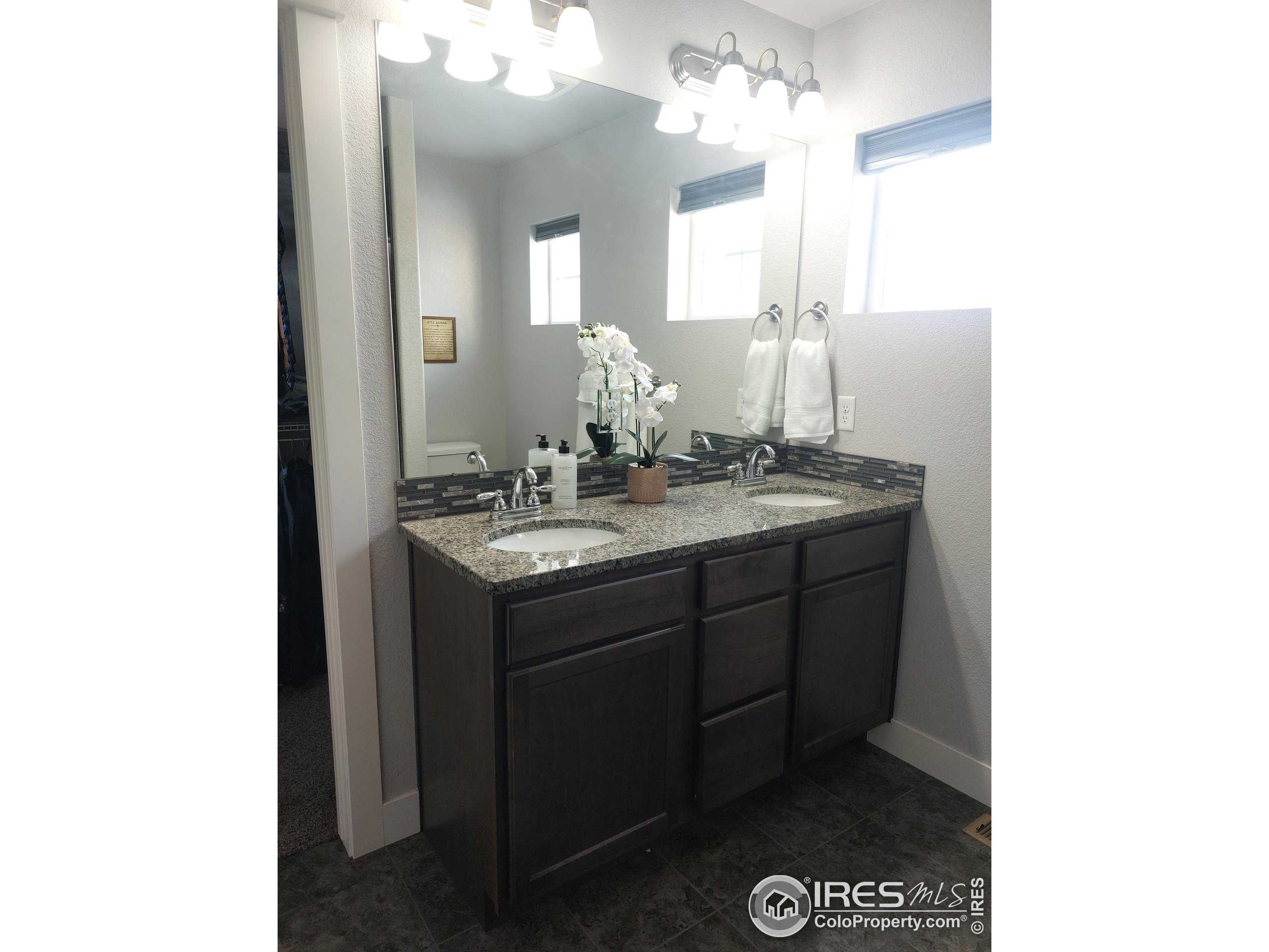 2263 Adobe Drive Fort Collins, CO 80525 - Photo 16 of 25 a bathroom with a sink and a mirror