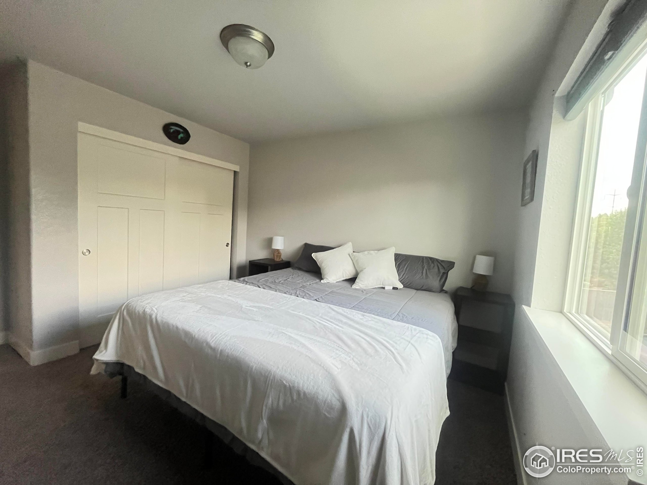 2263 Adobe Drive Fort Collins, CO 80525 - Photo 21 of 25 a bedroom with a bed and a window