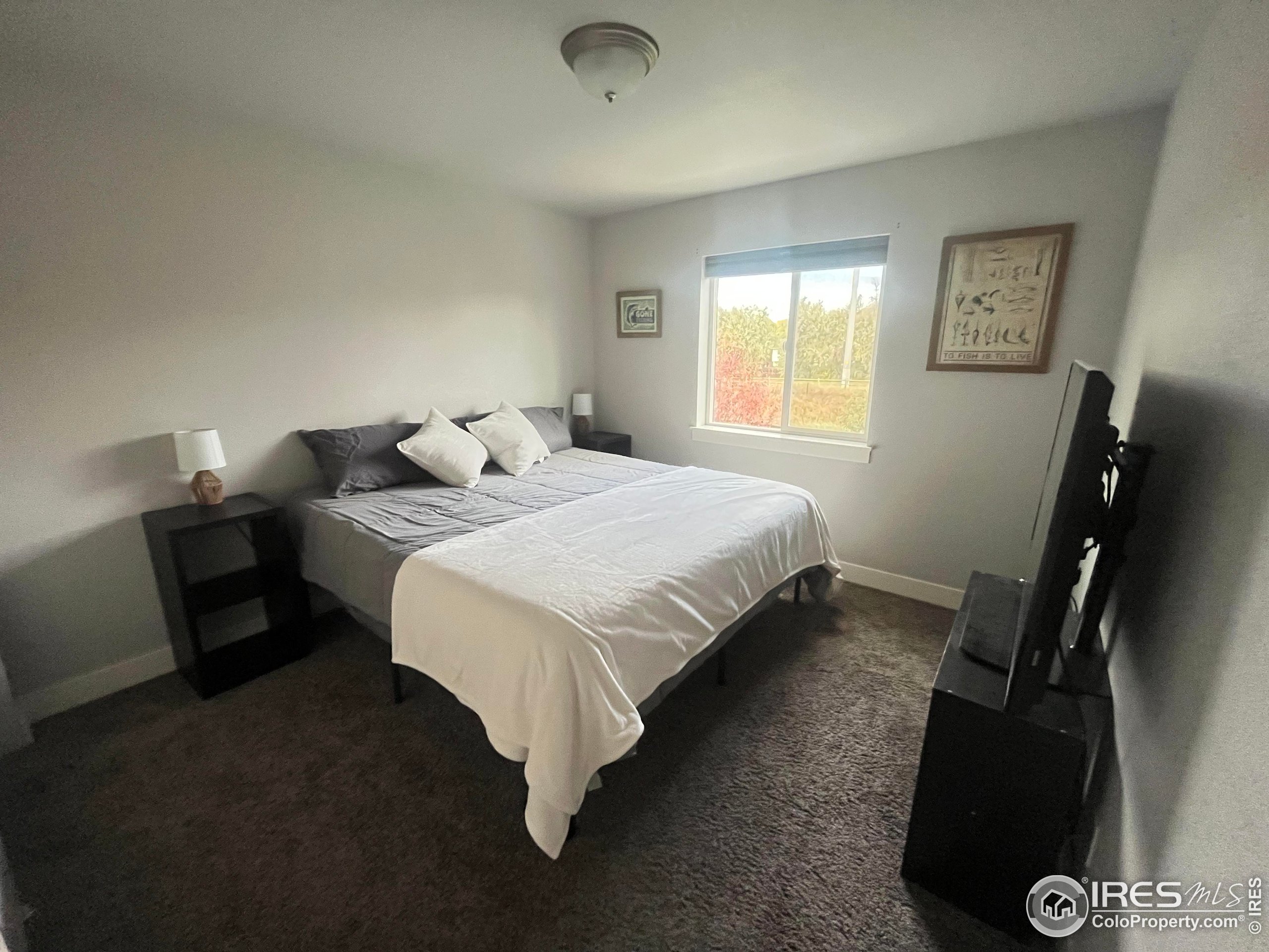 2263 Adobe Drive Fort Collins, CO 80525 - Photo 22 of 25 a bedroom with a bed and a couch