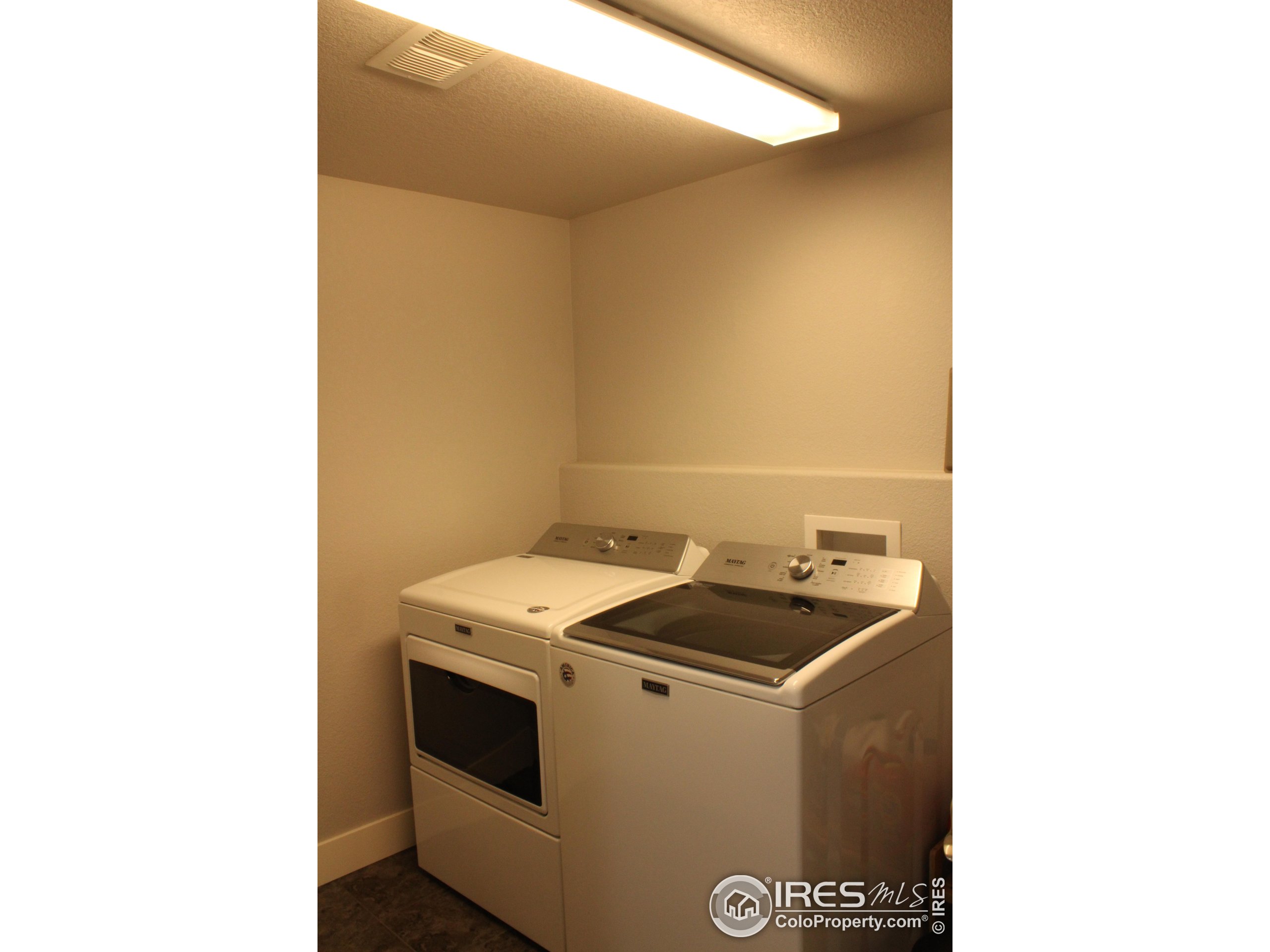 2263 Adobe Drive Fort Collins, CO 80525 - Photo 24 of 25 a utility room with dryer and washer