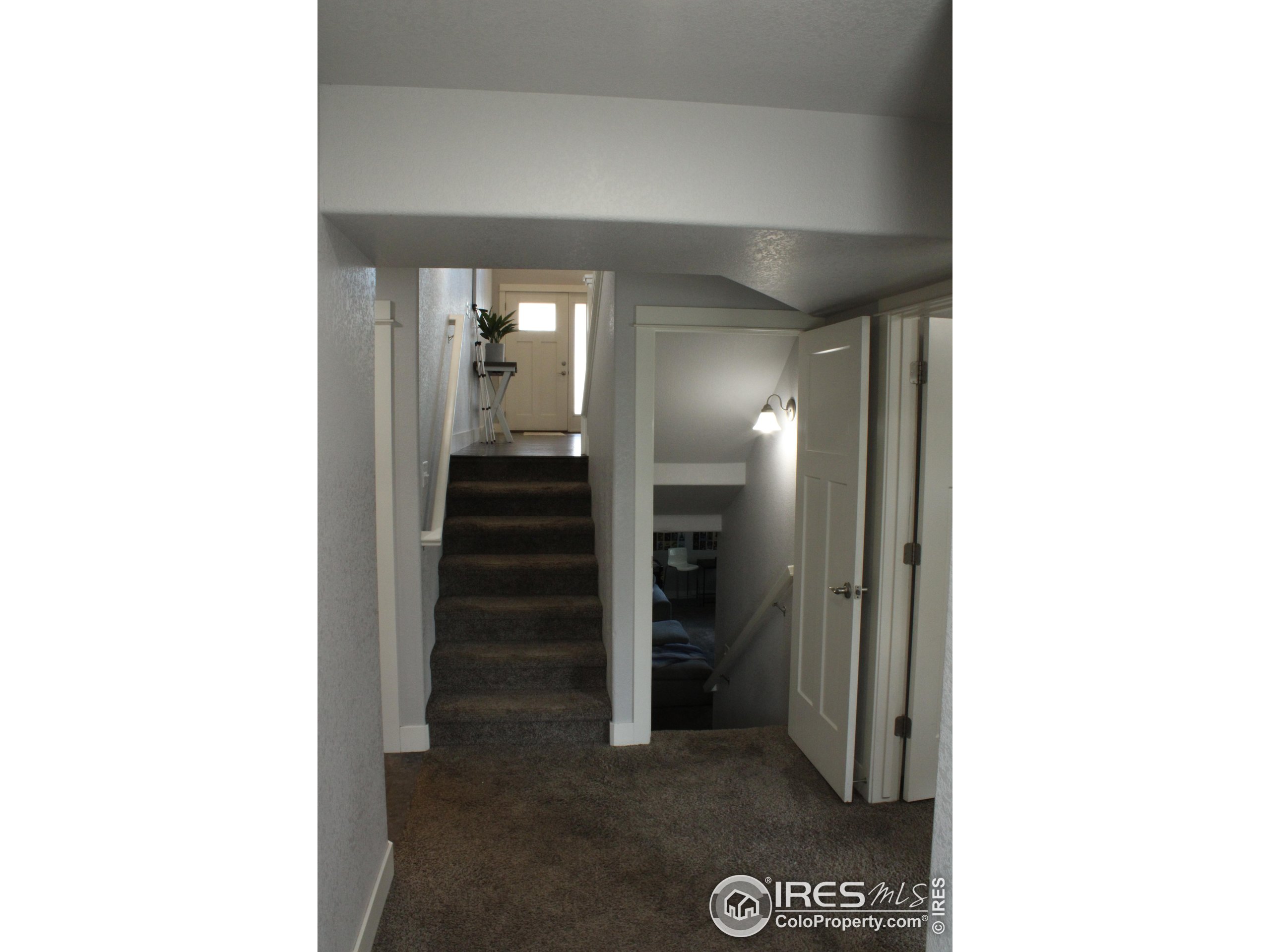 2263 Adobe Drive Fort Collins, CO 80525 - Photo 8 of 25 a view of a hallway with a room and stairs