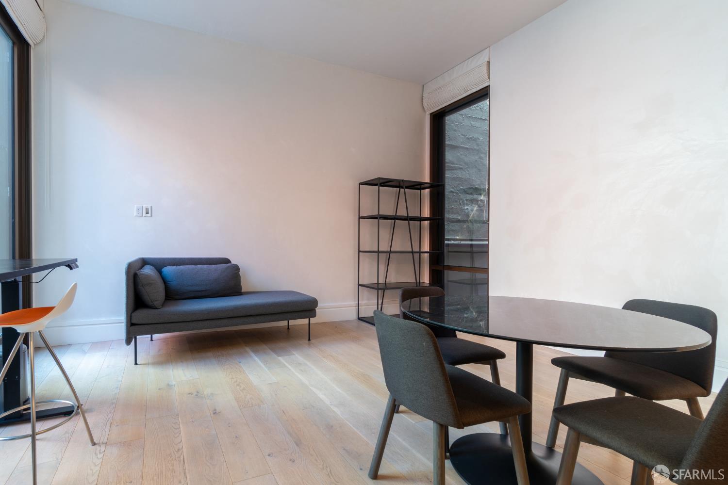 288 Pacific Avenue, Unit 2F San Francisco, CA 94111 - Photo 25 of 34 a living room with furniture and a wooden floor