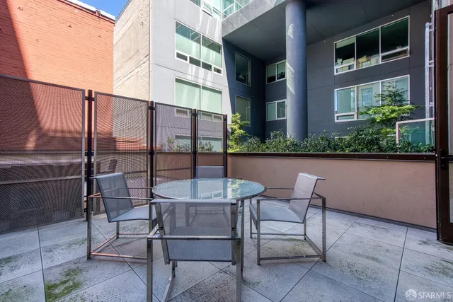 a couple of chairs sitting in front of a building