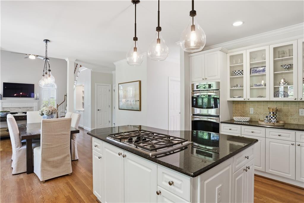 4662 Gilhams Road Roswell, GA 30075 - Photo 11 of 71 a kitchen with granite countertop a sink stove and cabinets